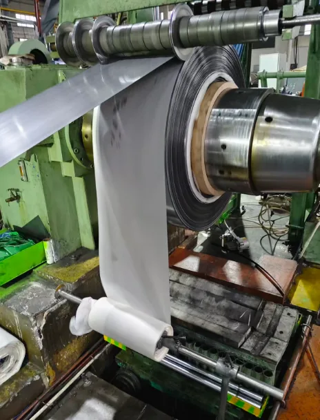 Spring steel strip being slit